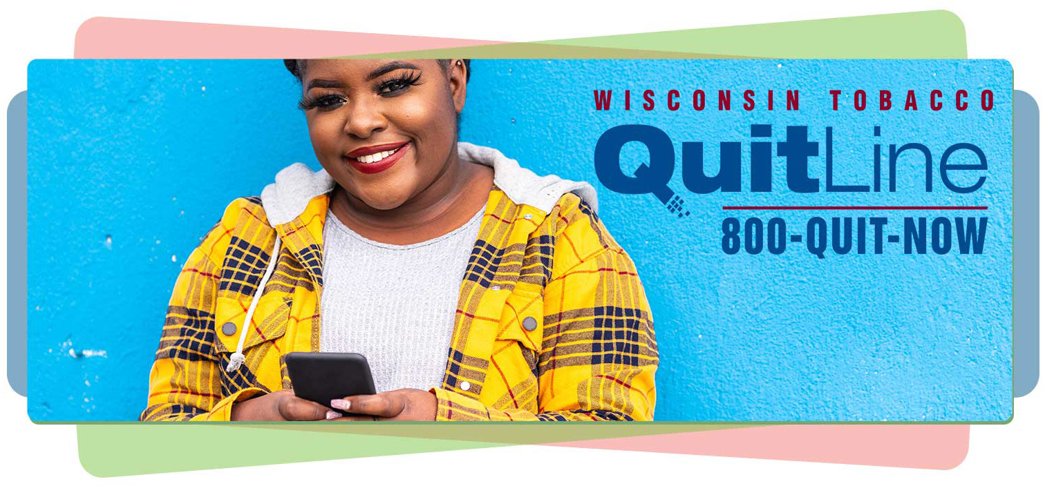 A person smiles while talking to the Quit Line at 800-784-8669